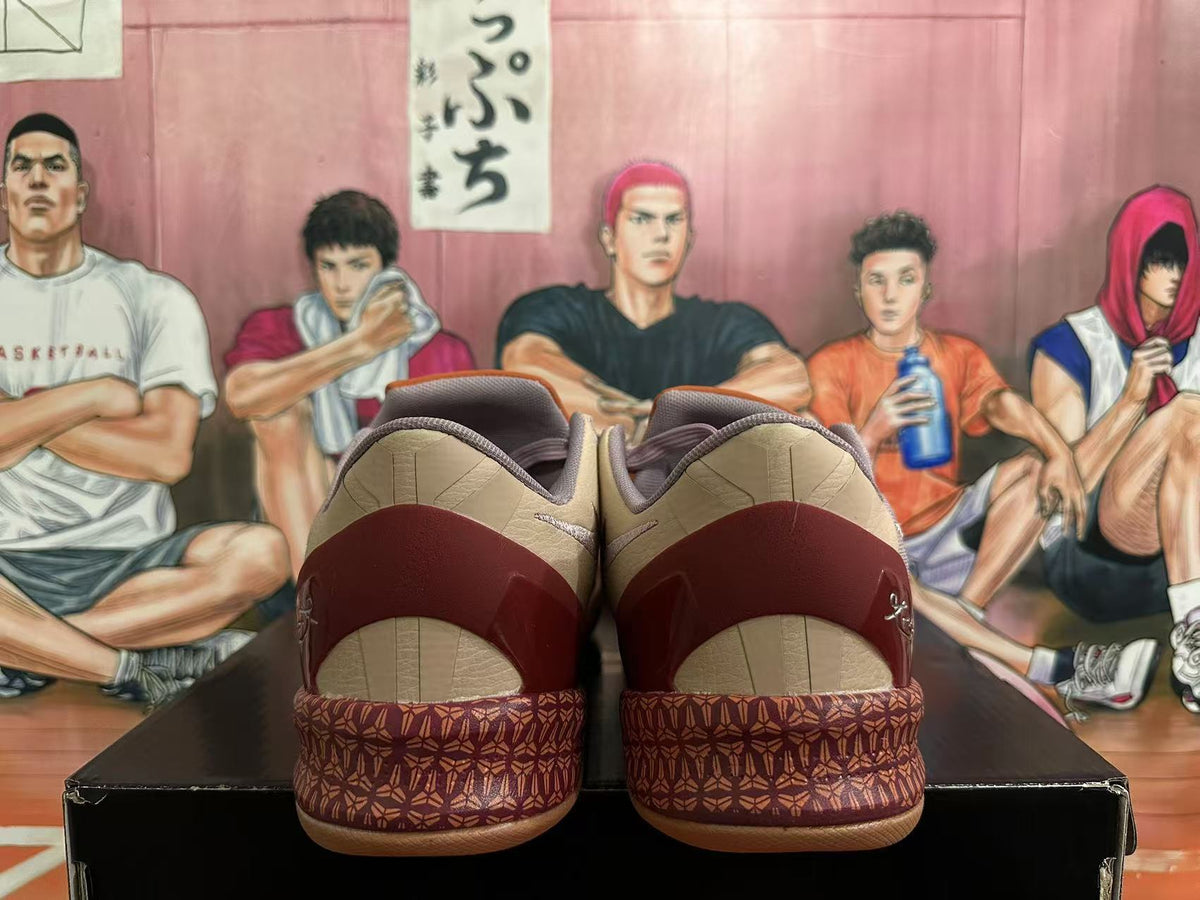 Rear view of mauve and burgundy Nike Kobe basketball shoes with patterned heel details