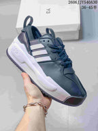Dark navy Y-3 Rivalry low-top sneaker with textured side panels and a light-colored sole.