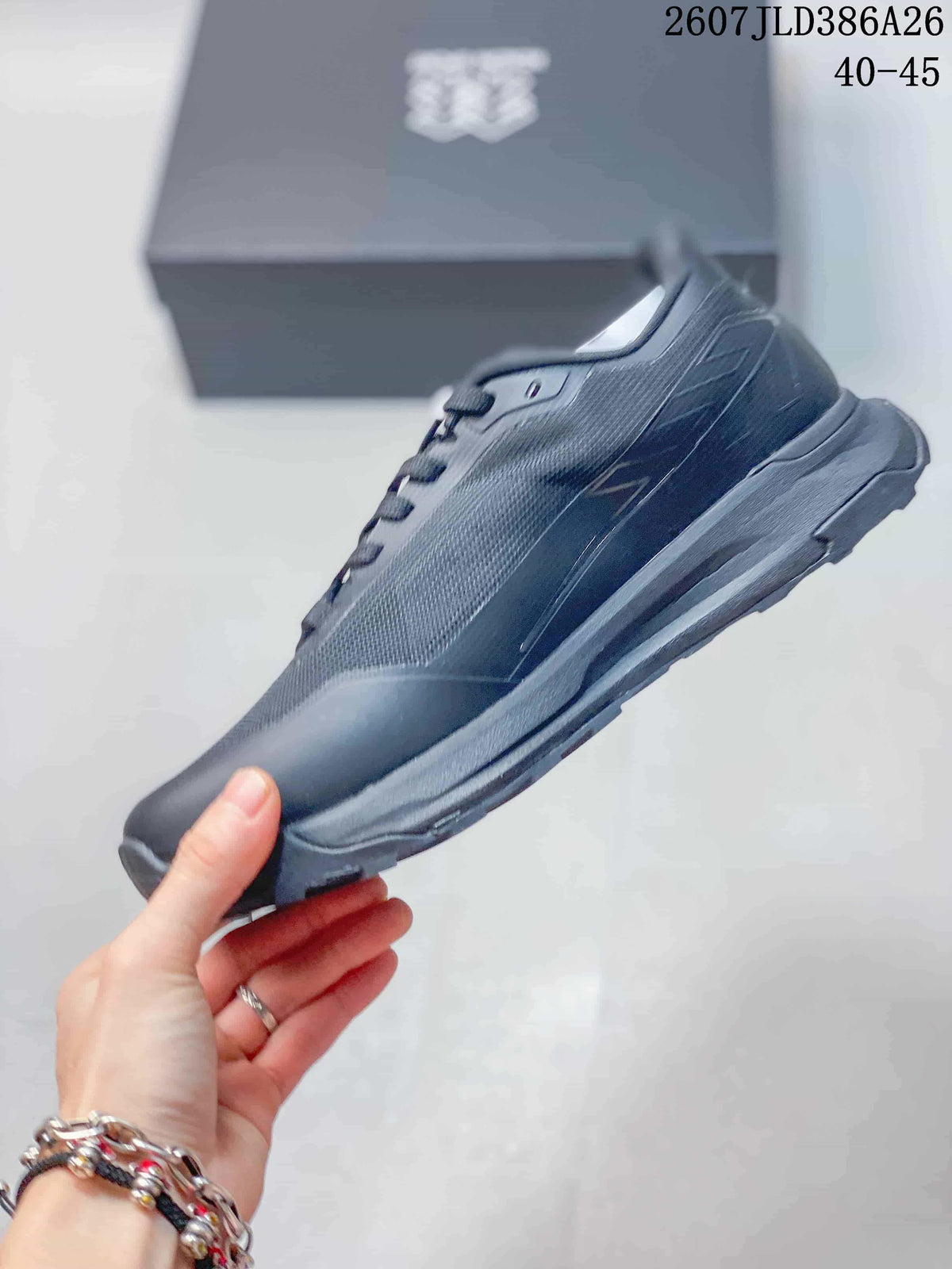 Side profile of the dark gray and black outdoor hiking shoe with mesh-style panels and a rugged sole.