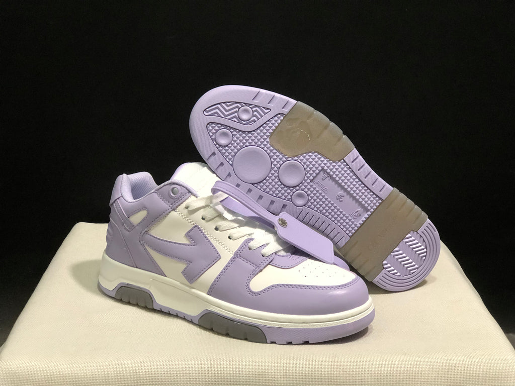 Angled view of one sneaker beside an outsole-facing shoe, showing the patterned tread.