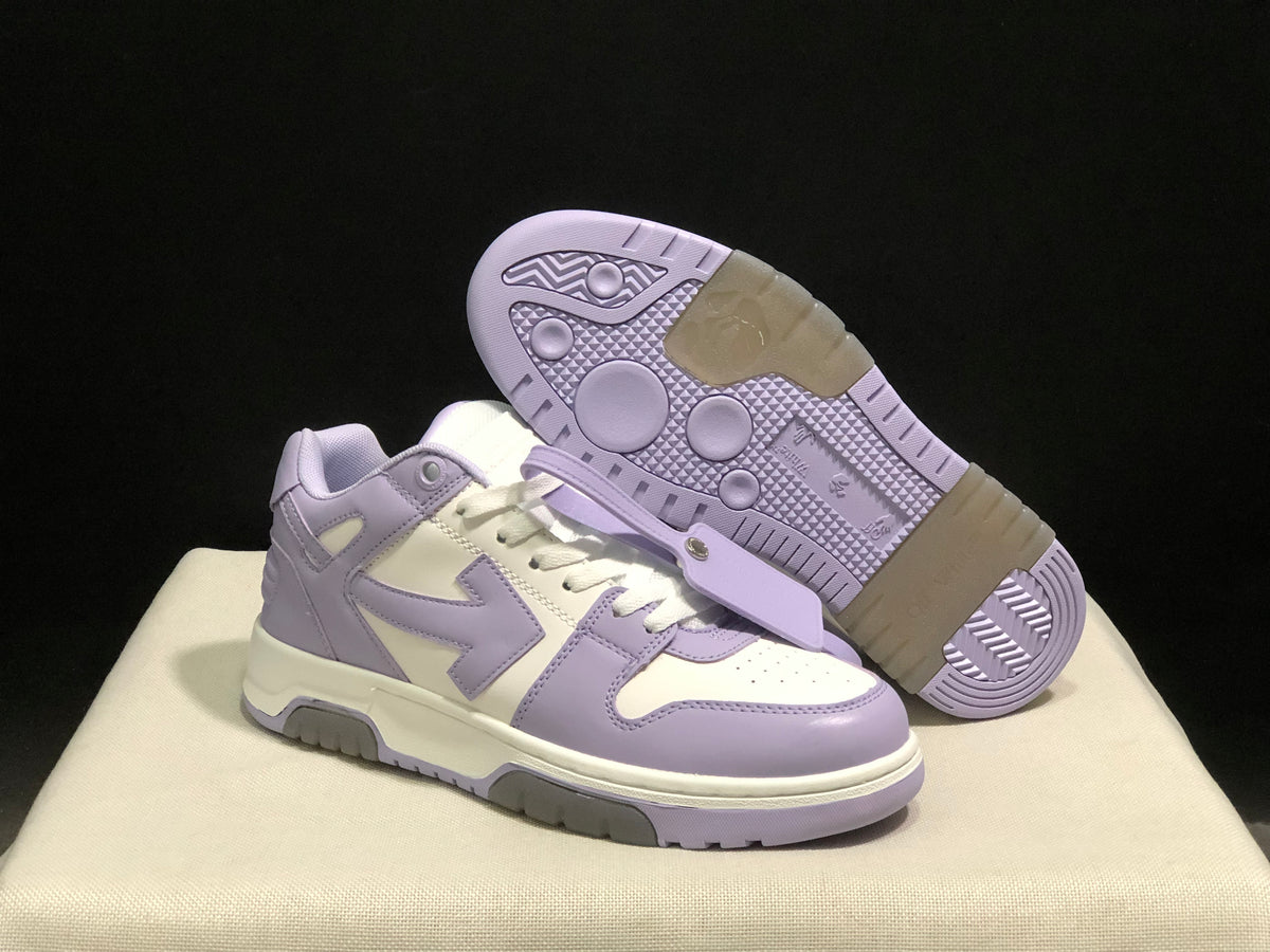 Angled view of one sneaker beside an outsole-facing shoe, showing the patterned tread.