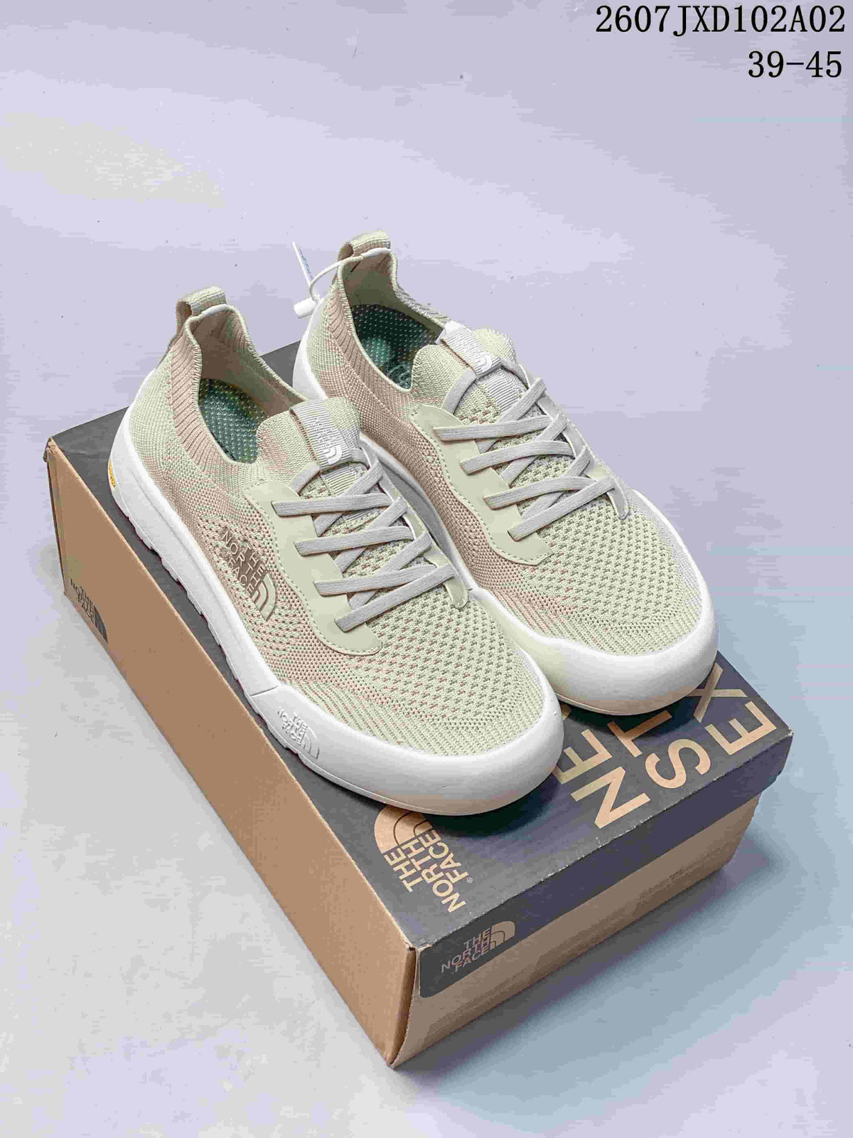 Three colorways of The North Face Dune sneakers shown from the side: gray and olive, light sage, and dark blue-gray.