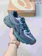 ASICS GEL-SD Lyte sneaker in dark blue-gray and teal, shown with a shoebox.
