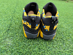 Rear view showing yellow patterned panels and gray soles