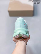Rear view of the mint green sneaker showing the padded heel, On branding, and layered sole.