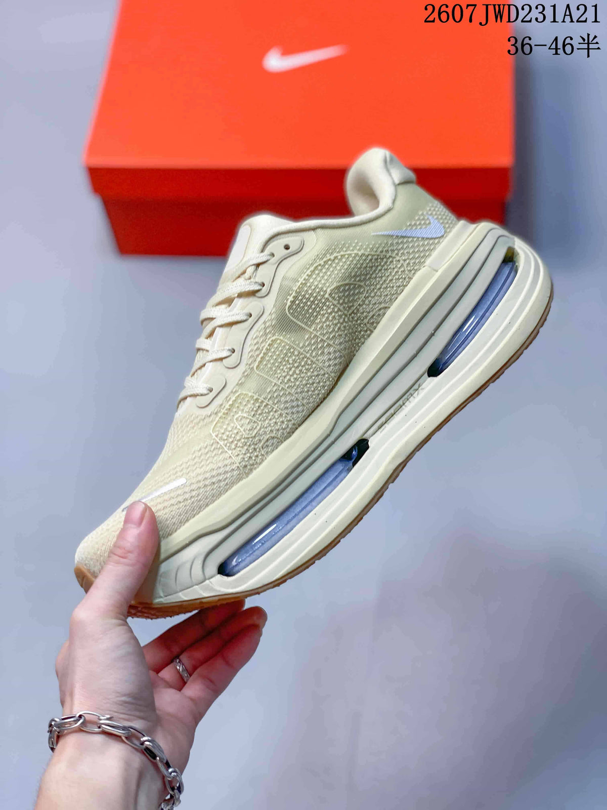 Side profile highlighting the textured upper, layered overlays, Nike Swoosh, and visible blue midsole cushioning units.