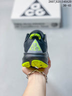 Rear view showing the ACG heel branding and neon green outsole accents.