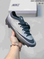 Black and gray Nike soccer cleat with a dark outsole and contrasting light side detail.