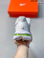 Rear view of the sneaker showing the padded heel, white midsole, and translucent green cushioning unit.
