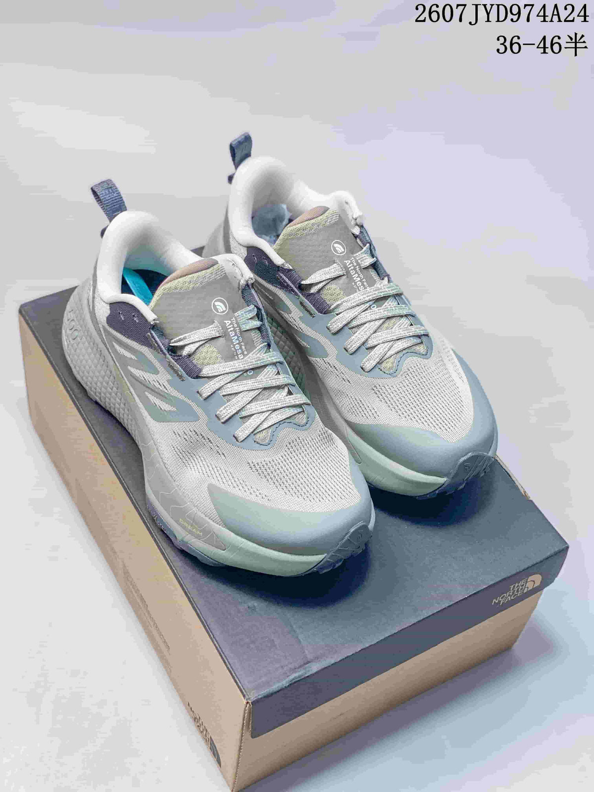 Pair of gray and pale green The North Face Altamesa 500 sneakers displayed on a shoebox; overlay shows style code 2607JYD974A24 and size range 36–46.5.