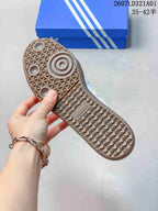 Close-up of the textured gum-colored outsole on a Samba Jane sneaker.