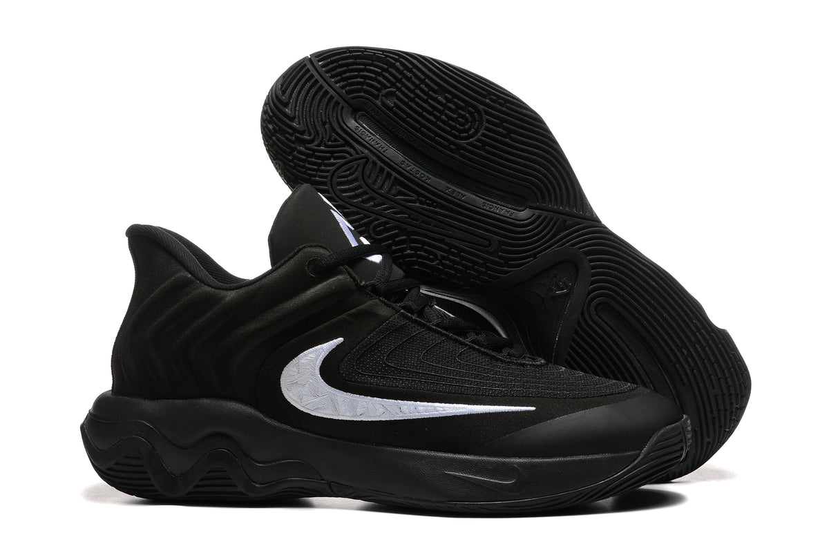 Black basketball shoe with a white side detail and patterned outsole.