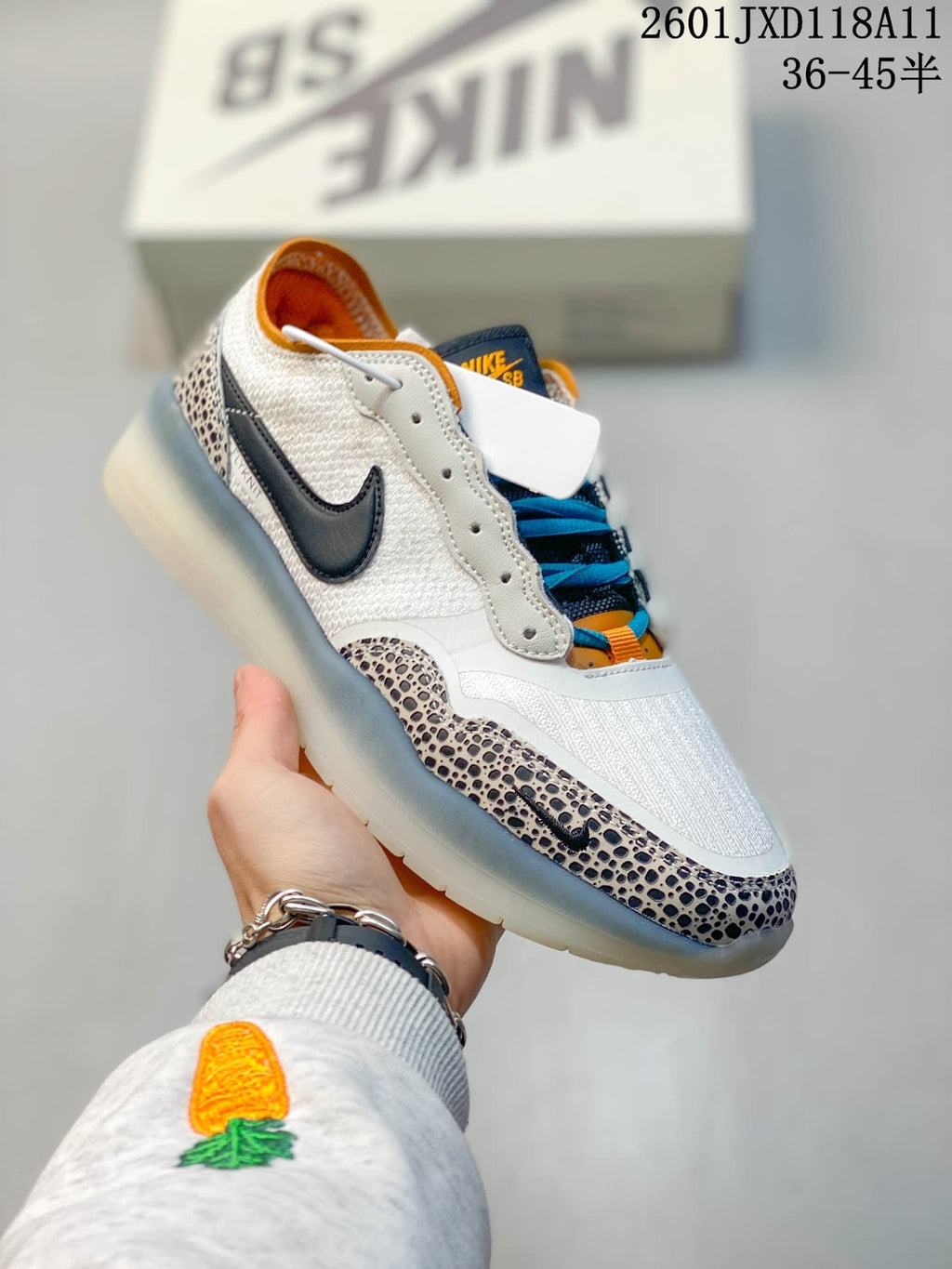 Angled side view of the Nike SB PS8 sneaker showing the white and patterned upper, dark Swoosh, blue laces and translucent outsole.