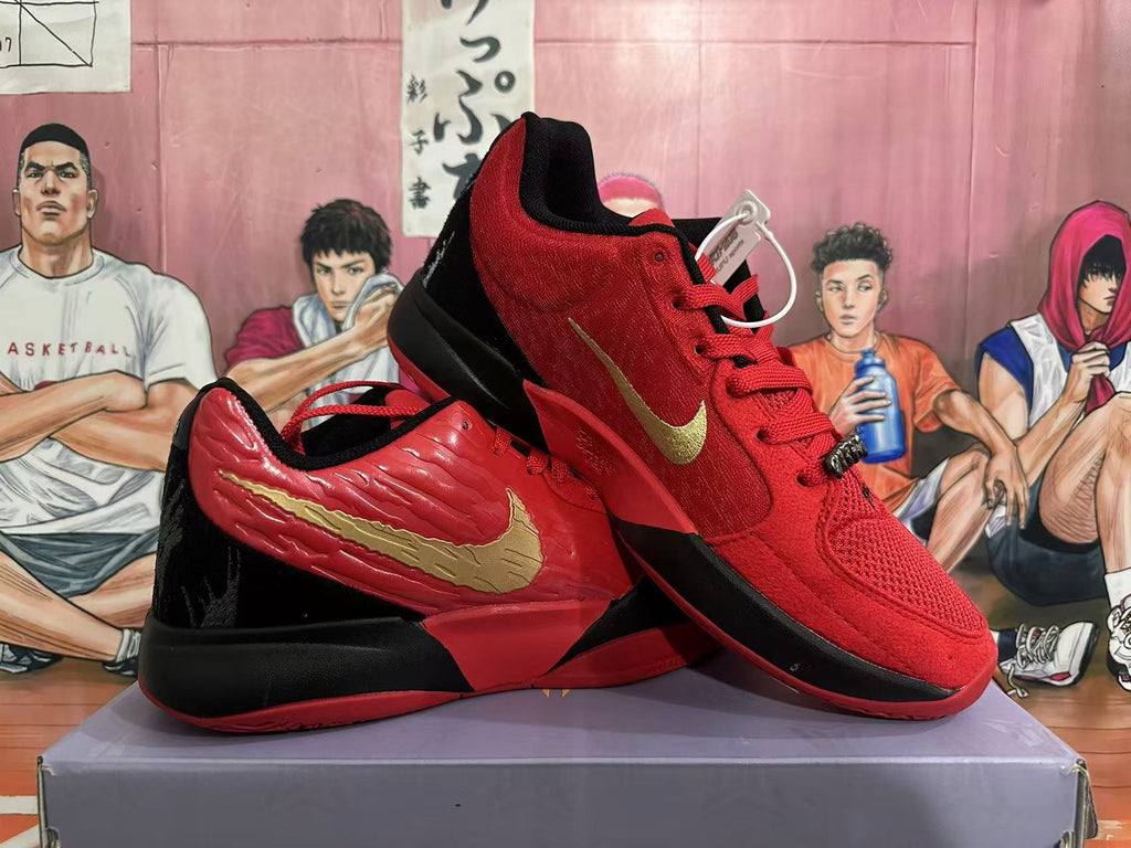 Pair of red and black Nike basketball shoes shown from the side and front