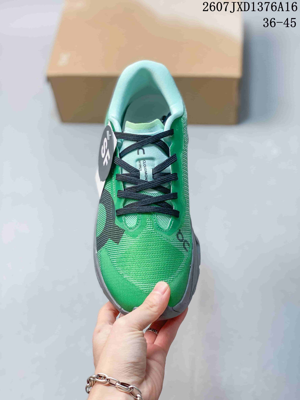 Top view of the green sneaker showing the black lacing system, padded collar, and tongue markings.