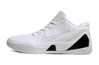 Side view of an all-white low-top basketball shoe.