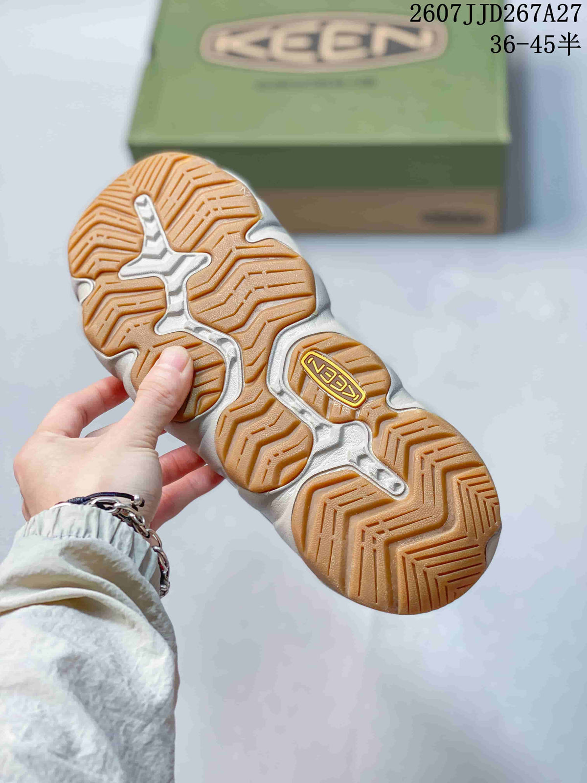 Close-up of the sandal outsole showing a segmented gum-colored tread pattern and KEEN branding.