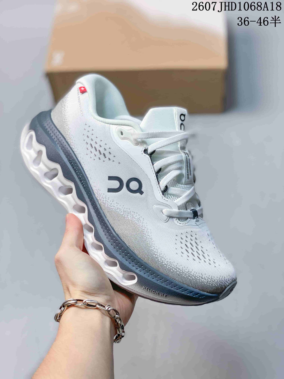 Light gray On Cloudsurfer 3 sneaker with a dark gray midsole section and white outsole.