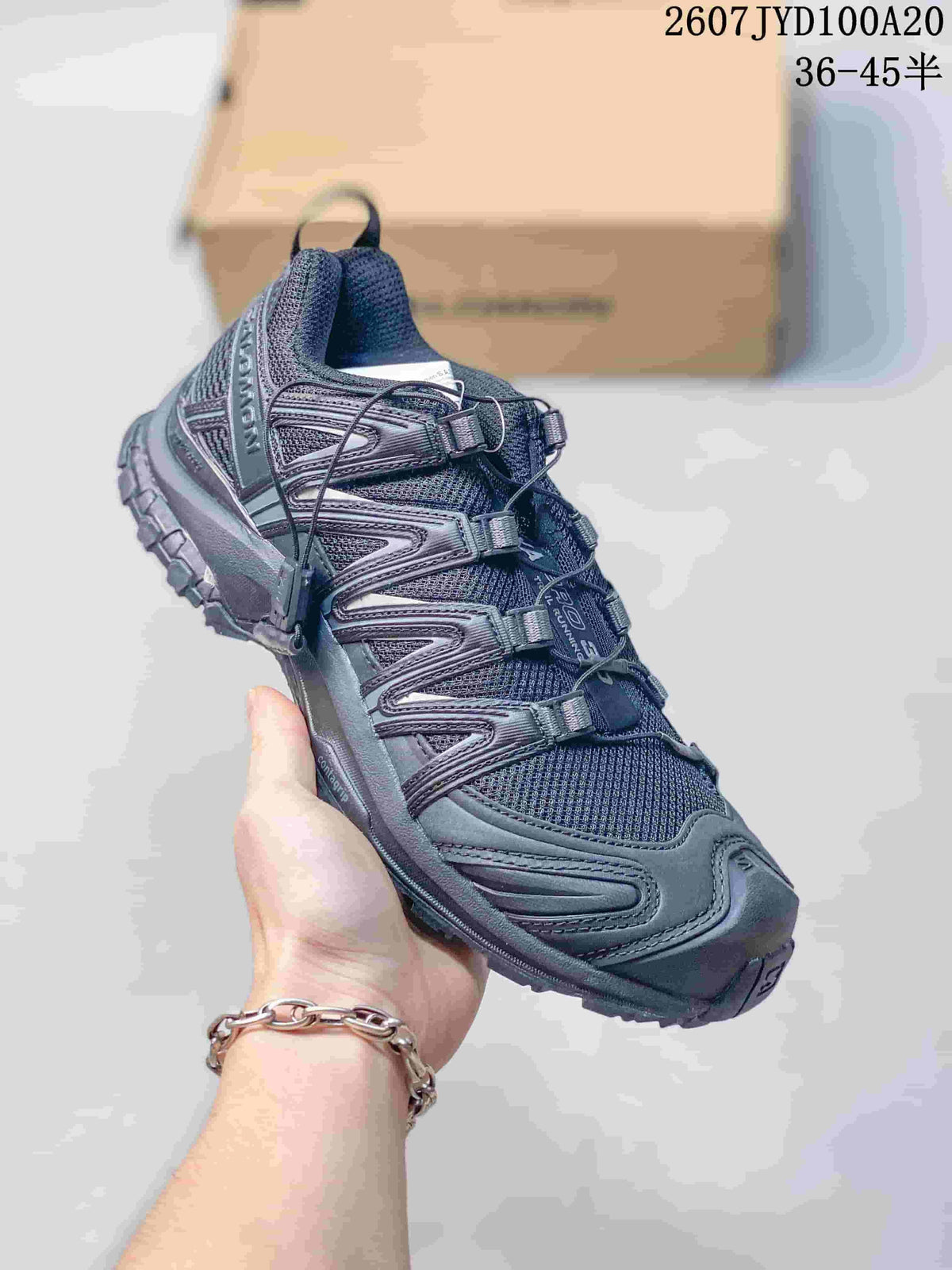 All-black Salomon XA PRO 3D trail shoe with a textured mesh upper and rugged lugged outsole.