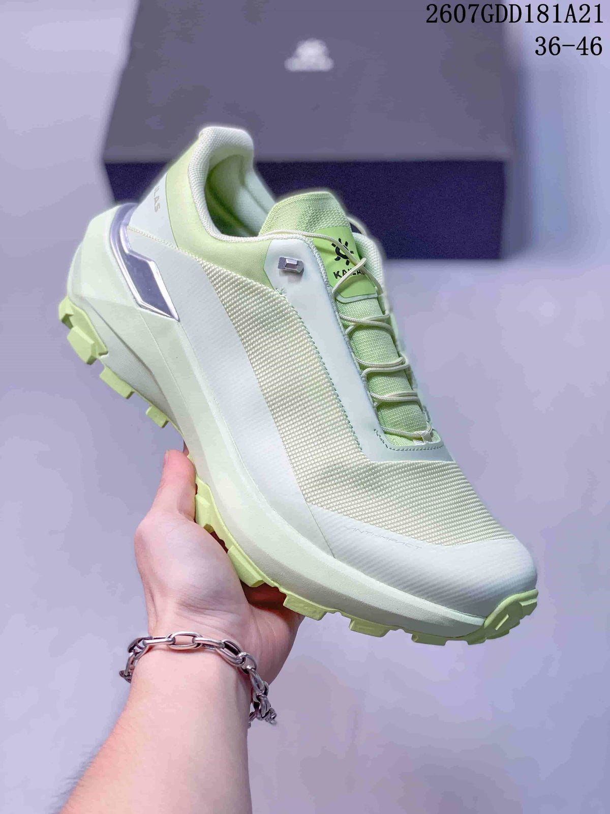 Side and front view of a pale green KAILAS VENTO trail running shoe with a lugged outsole and structured lacing.