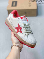 Three-quarter side view showing the white upper, red star detail, cream laces, textured toe panel and Ball Star side branding.