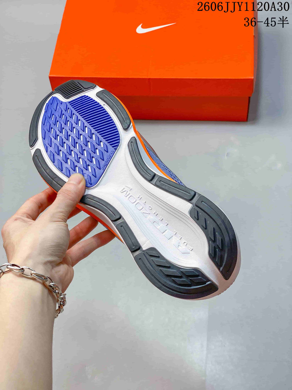 Close-up of the patterned outsole of a Nike Pegasus 42 shoe.