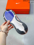 Close-up of the patterned outsole of a Nike Pegasus 42 shoe.
