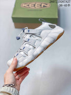 Side view of the KEEN sandal showing the layered upper, ventilation openings, adjustable fastening, white midsole, and gum-colored outsole.
