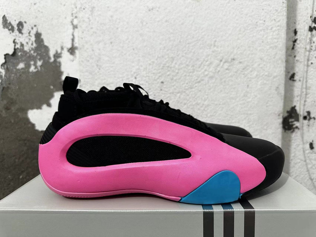 Side view showing the pink wraparound structure, black inset, and blue accent.