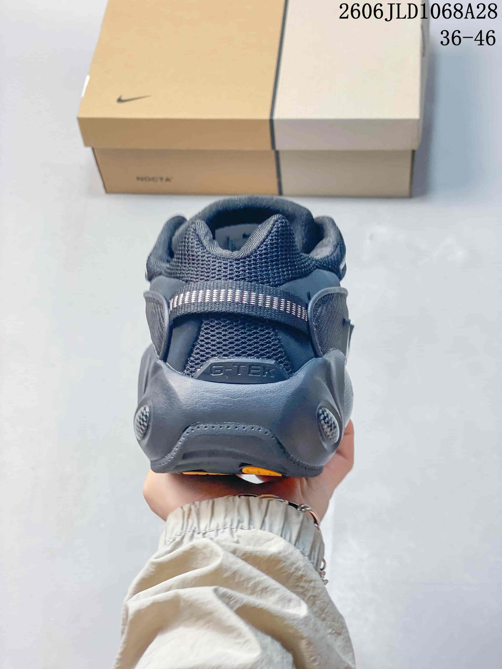Rear view showing the heel and padded collar of the sneaker.