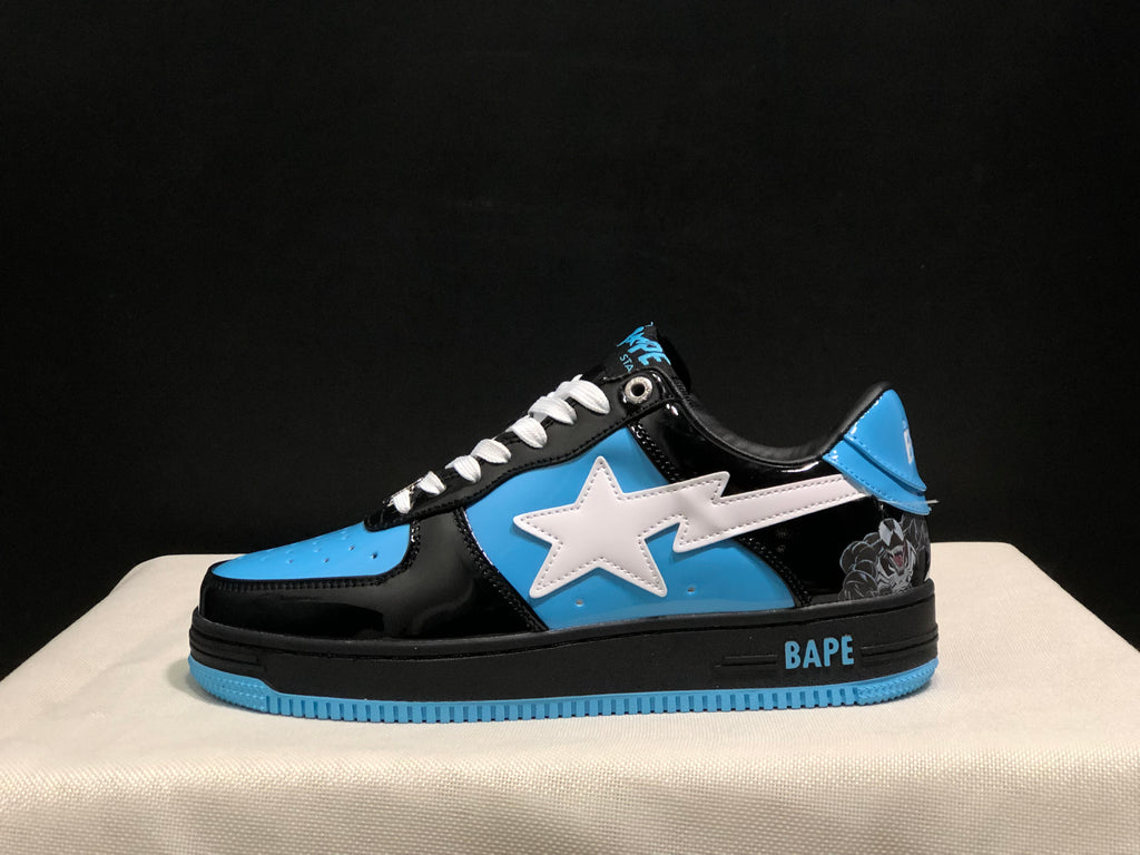 Side profile showing the white star motif, blue side panel, black upper, padded collar, and blue outsole edge.
