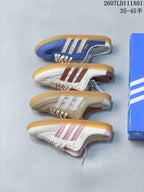 Four colorways of Adidas Samba-style mule sneakers arranged side by side.