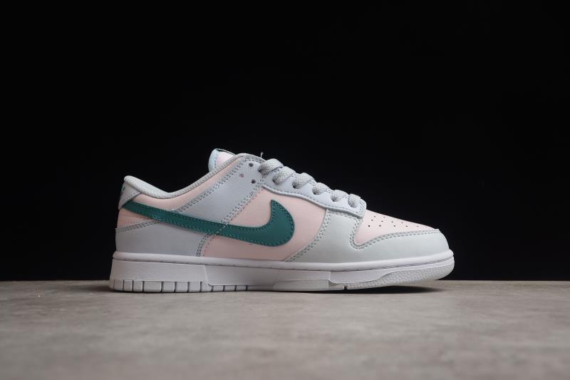 Side profile showing the low-top silhouette, green Swoosh and white rubber sole.