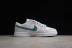 Side profile showing the low-top silhouette, green Swoosh and white rubber sole.