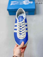 Top view showing the blue toe box, cream T-toe detailing, white laces and C.P. Company tongue label.