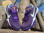 Front view of purple Kobe 8 shoes with gold Kobe logo details.