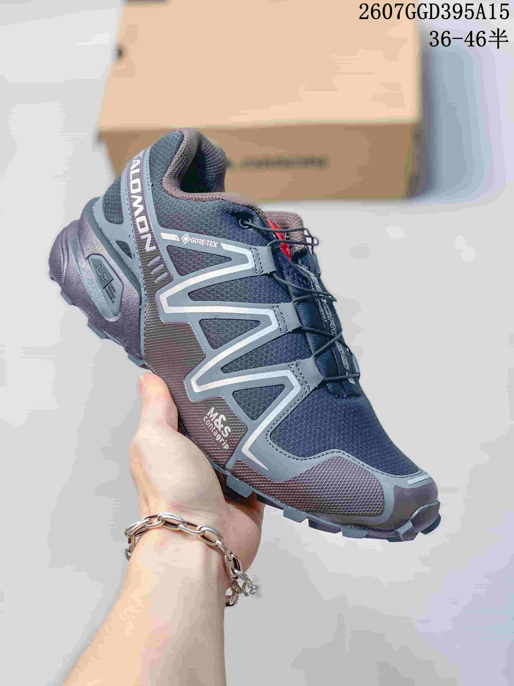 Angled side view of a Salomon Speedcross 3 shoe with visible Gore-Tex, Contagrip, and M&S Contagrip markings on the upper and sole.