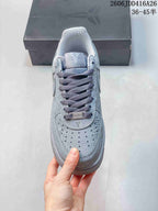 Front view showing the perforated toe, dark laces, and tongue graphics