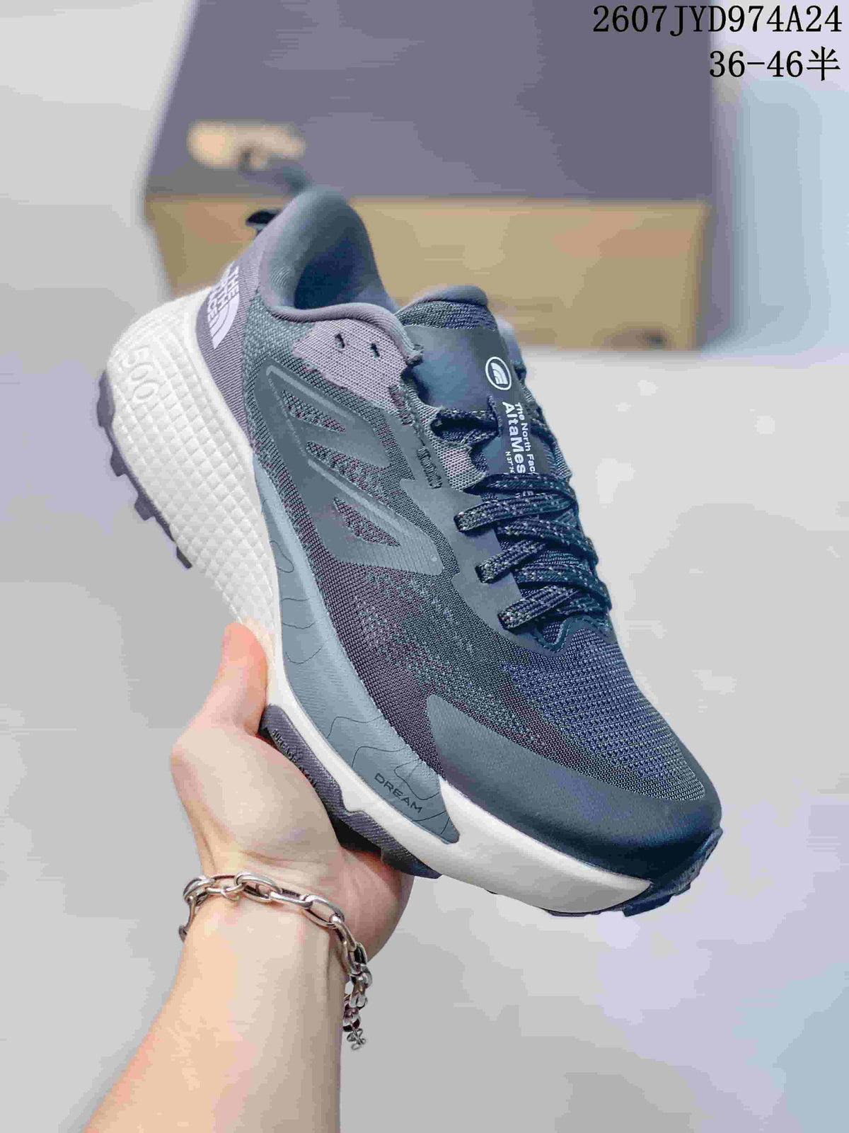 Angled side view of the dark gray The North Face Altamesa 500 sneaker with white midsole and black outsole.