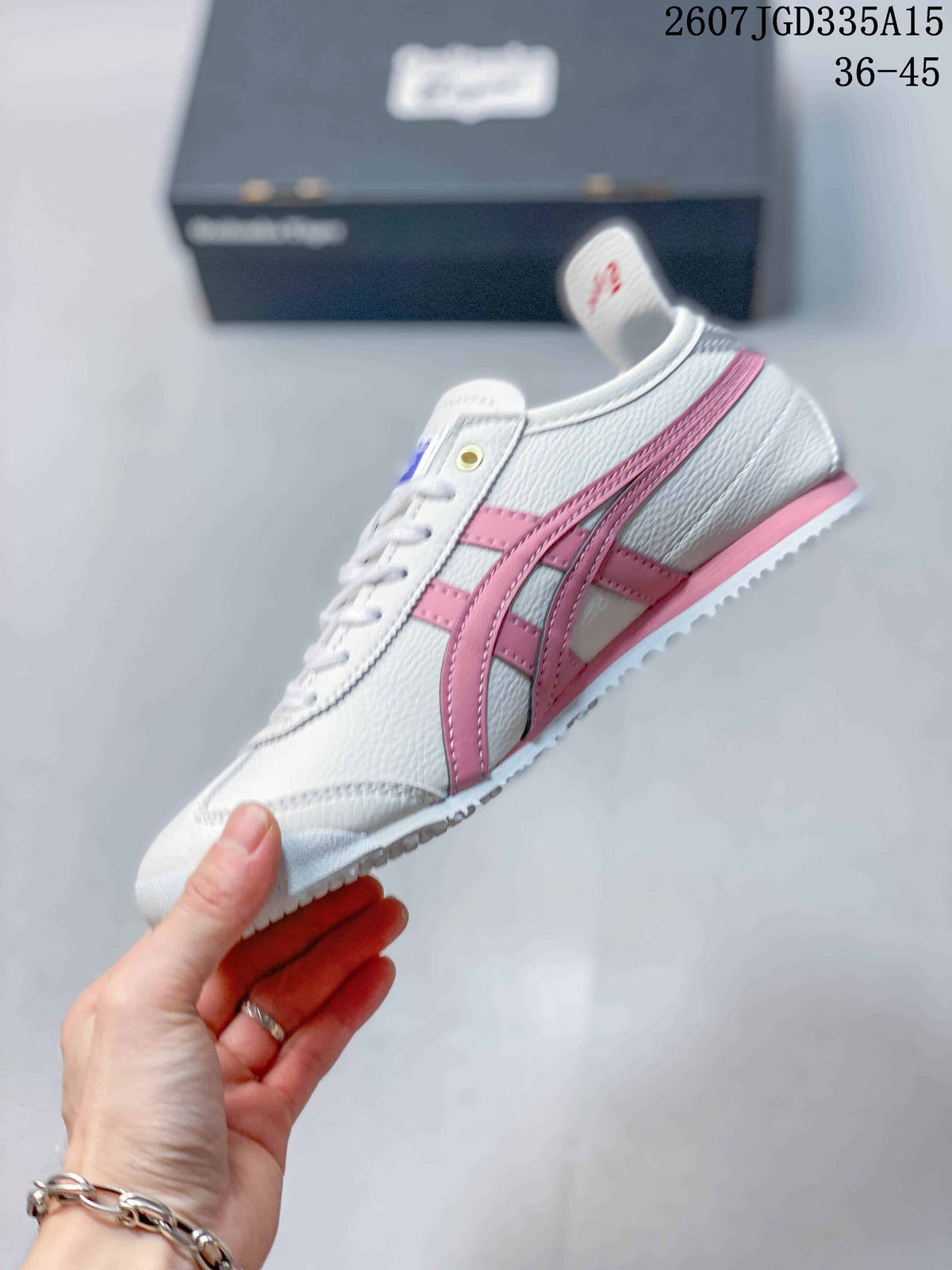 Side view of the white sneaker with pink Onitsuka Tiger stripes, white laces and a textured white outsole.