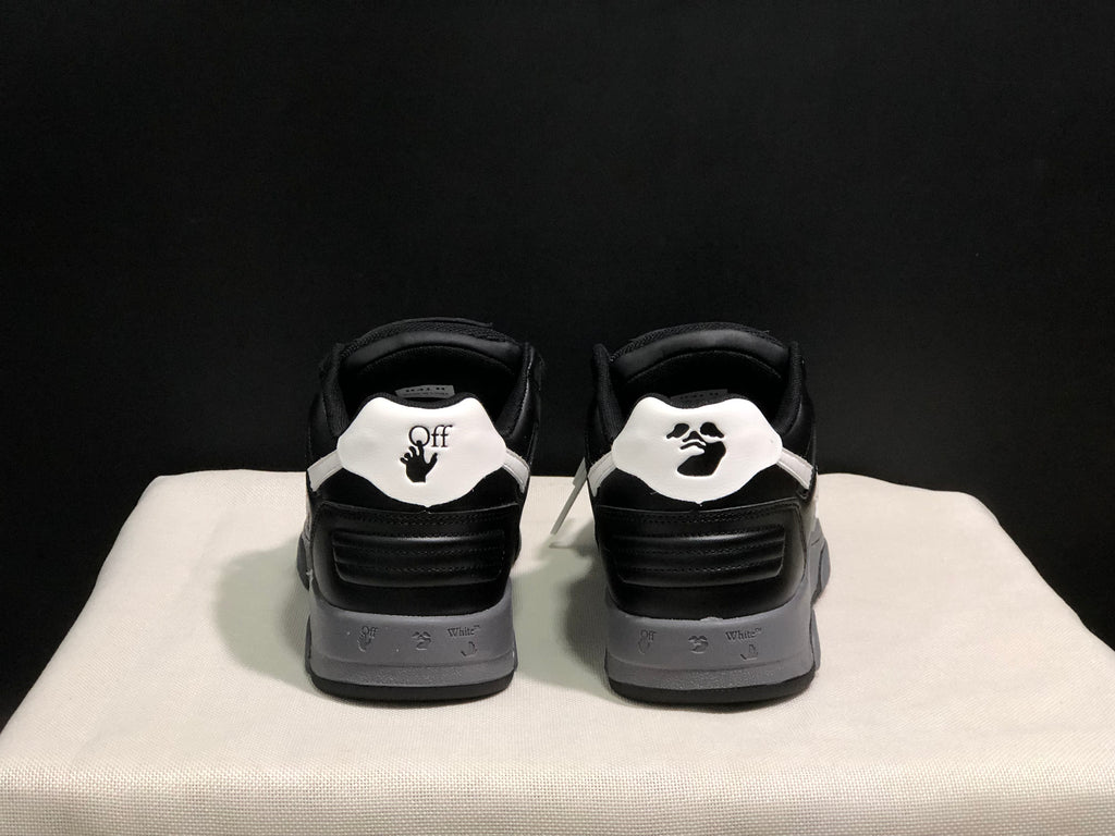 Rear view showing contrasting white heel panels, printed graphics, black padded collars, and layered gray midsoles.