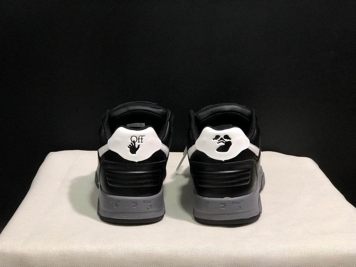 Rear view showing contrasting white heel panels, printed graphics, black padded collars, and layered gray midsoles.