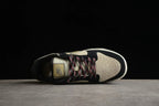 Top-down view of one sneaker showing the perforated toe, patterned laces, tongue, and panel layout.