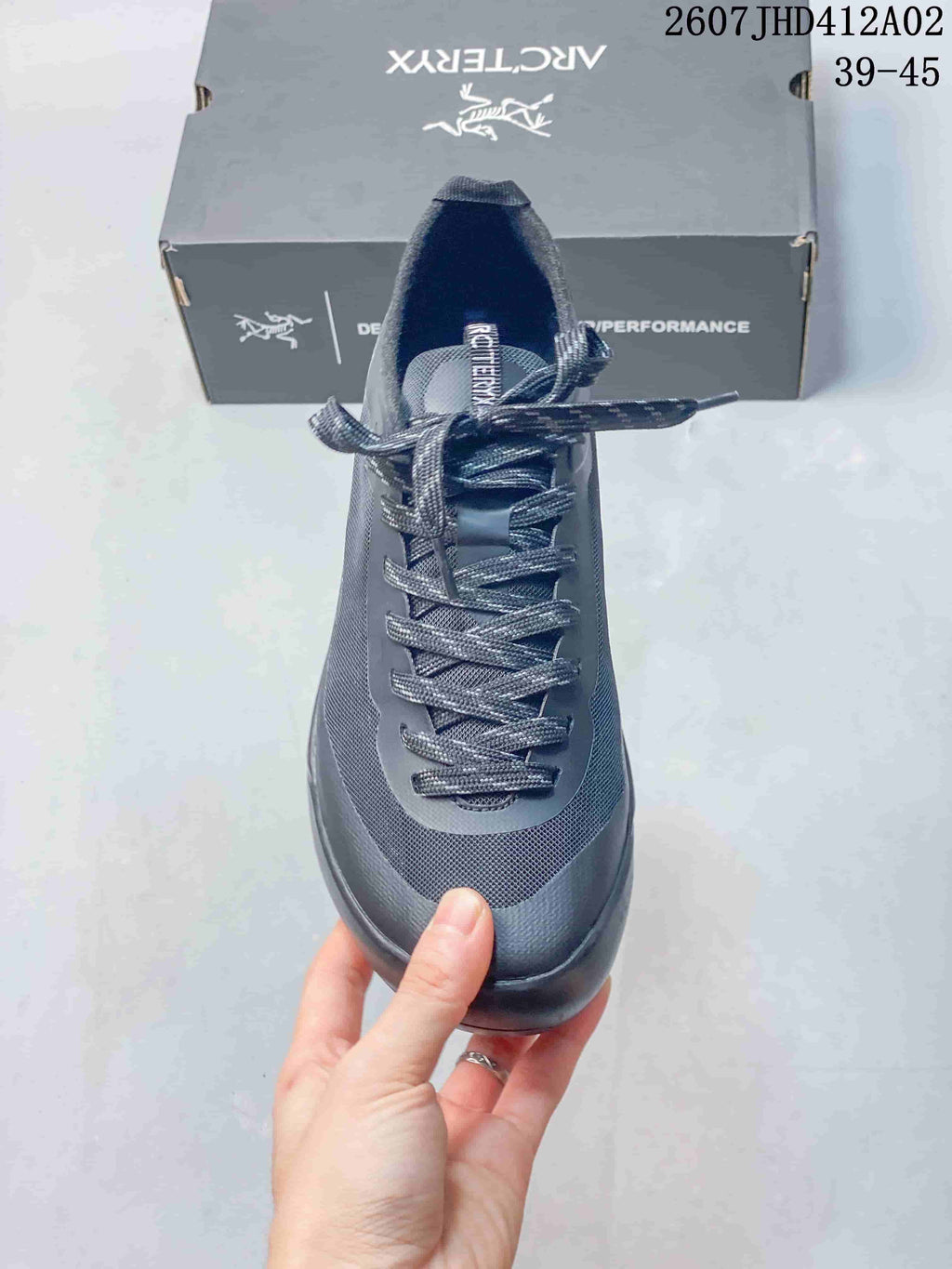 Top view showing the shoe's laces, tongue, and textured toe area