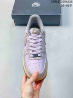 Top view of a lavender Nike Air Force 1 with perforated toe and lace-up closure