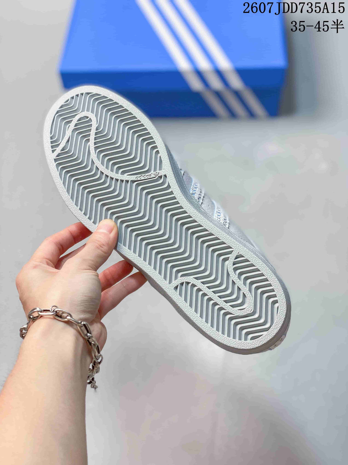 Bottom view of the sneaker showing the gray patterned rubber outsole.