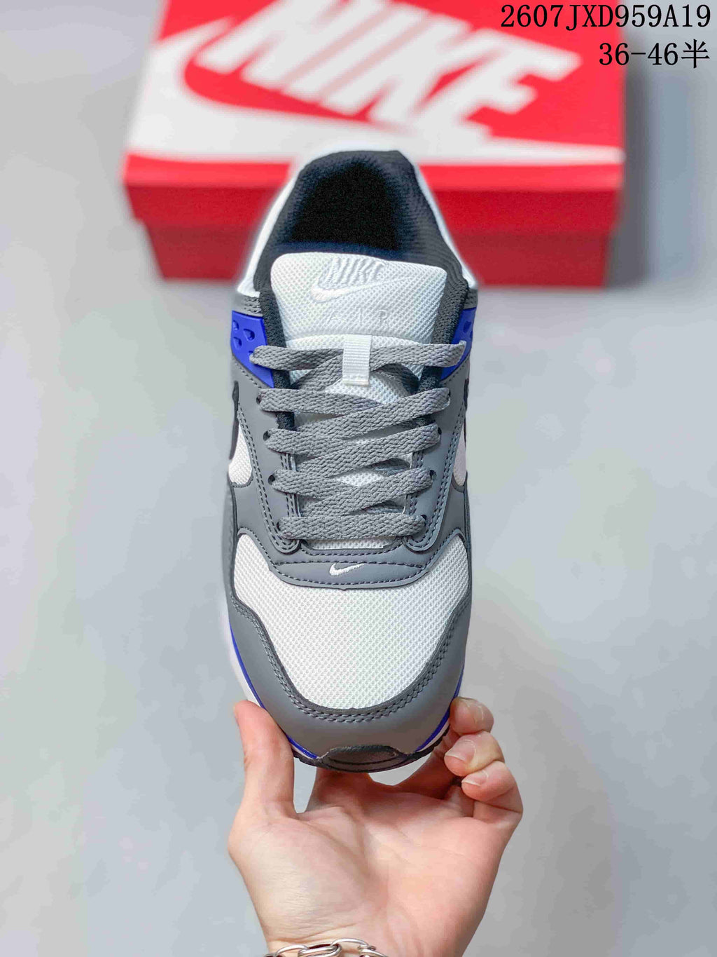 Top view showing the gray laces, white mesh-style toe area, and layered gray overlays.