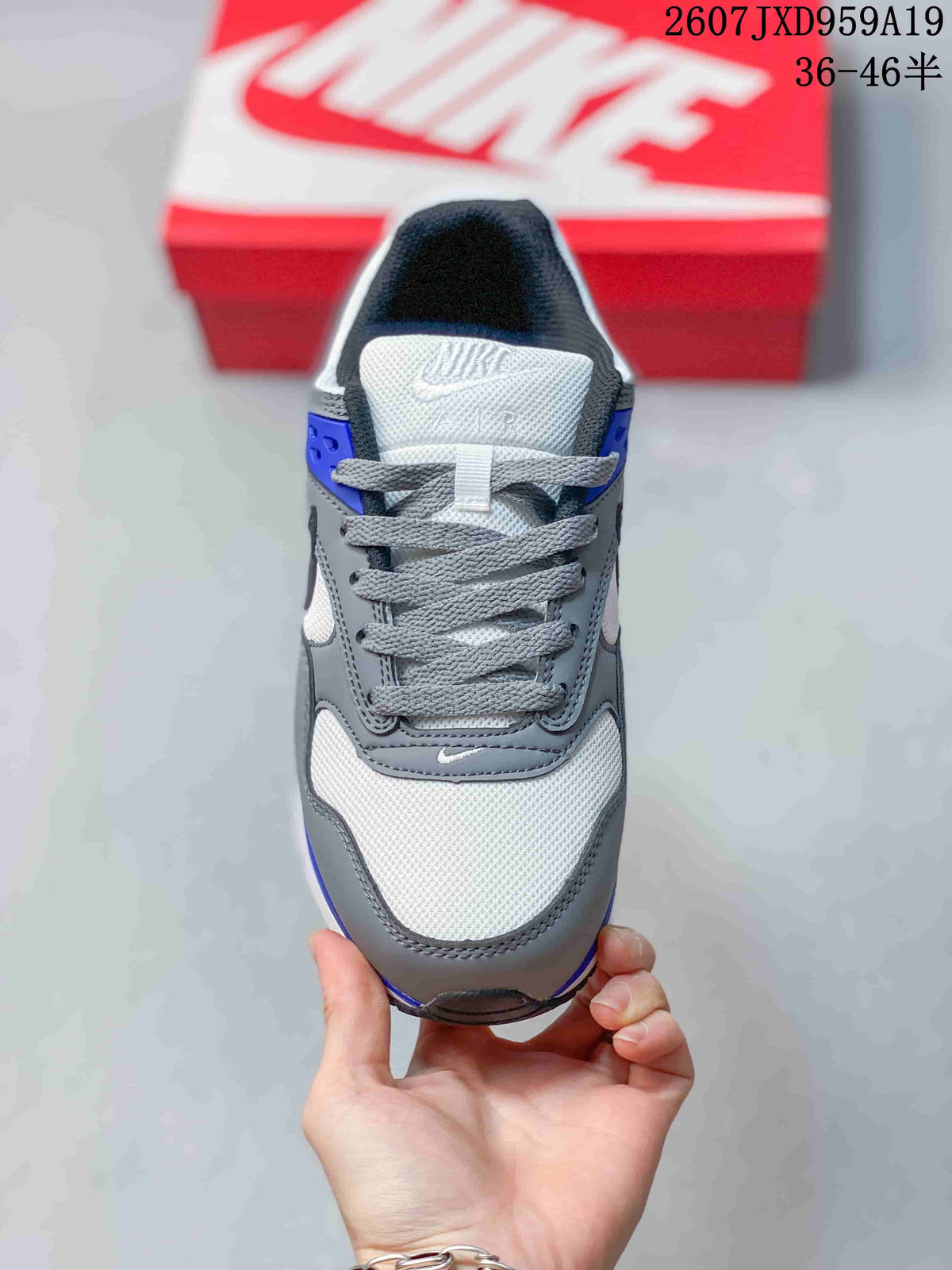 Top view showing the gray laces, white mesh-style toe area, and layered gray overlays.