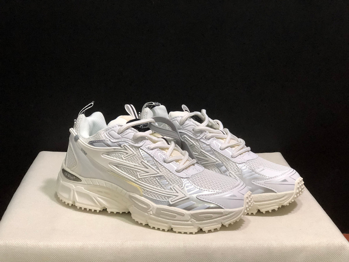Front three-quarter view of the pair showing rounded toes, layered upper panels, and chunky soles.