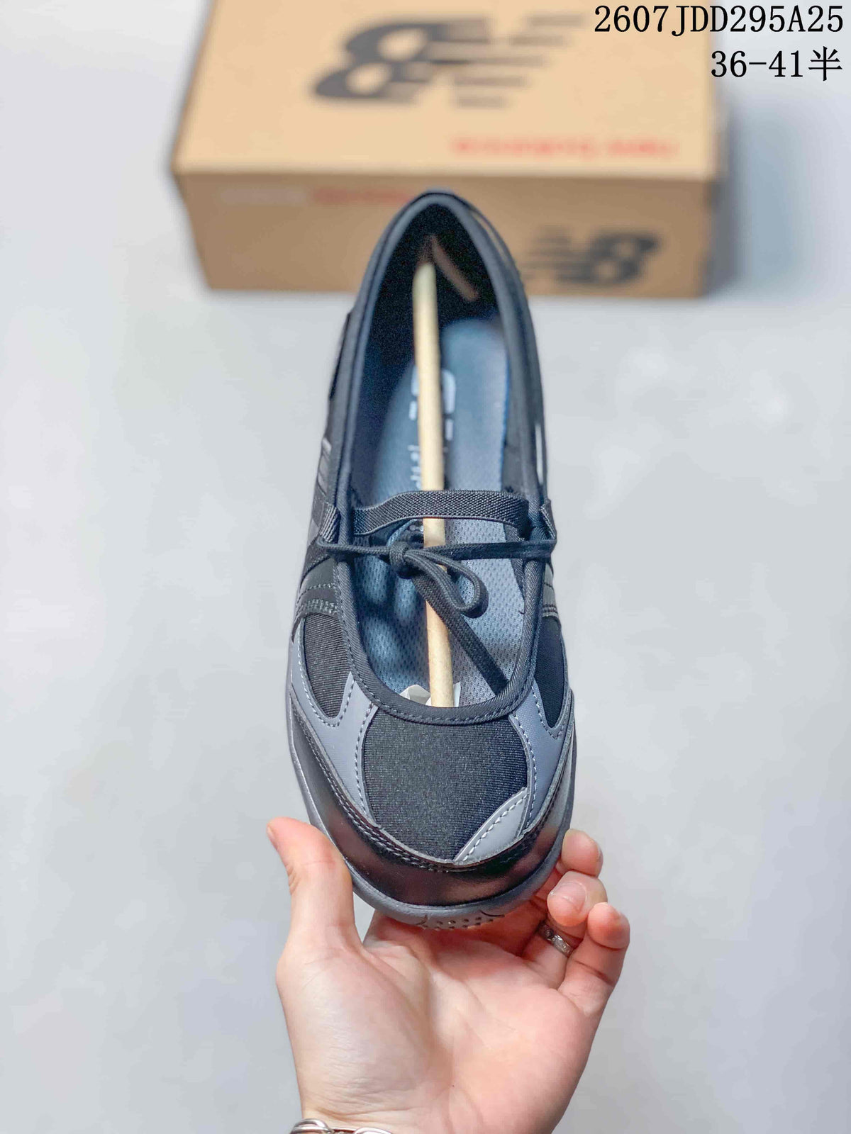 Top view showing the rounded T-toe shape, gray overlays, lace closure, and adjustable upper strap.